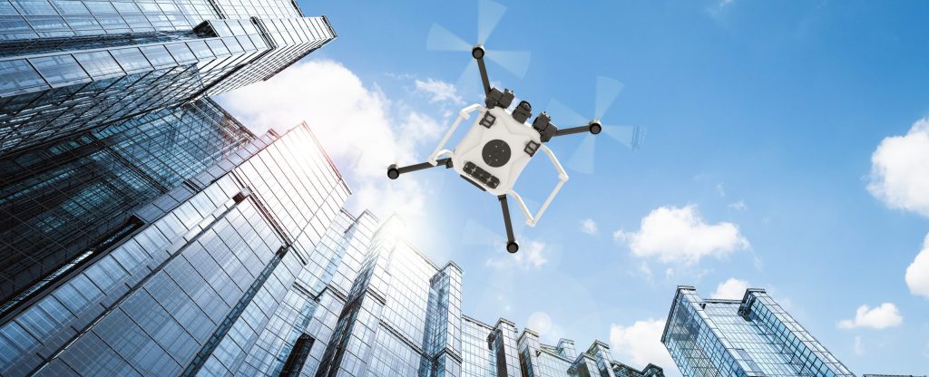 Drone scanning skyscrapers in the city. 